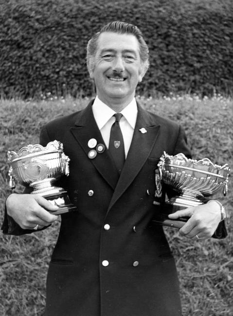 A delighted Les Davies cradles both top trophies, the Alfred Phillips Cup and Sudbury Bowl